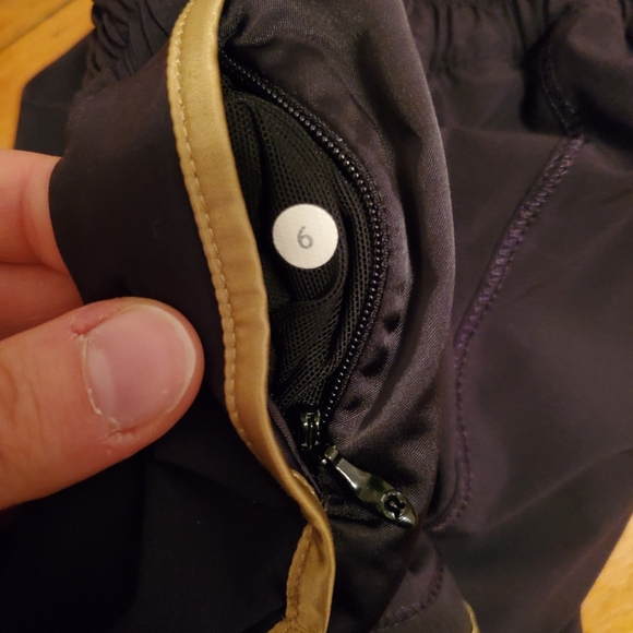 Lululemon Super Squad shorts. Black and gold. Size 6. Built in liner. - Picture 7 of 12
